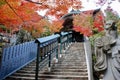 Majestic stone statue in front of the stone stairs of Daishoin Temple, Miyajima Royalty Free Stock Photo