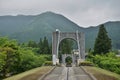 Majestic stony bridge for pedestrians spanning over the green valley in Nikko, Japan