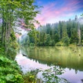 Majestic summer view of mountain lake Lacul Rosu or Red Lake or Killer Lake