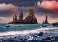 Majestic summer view of Reynisdrangar cliffs. Spectacular sunrise on Atlantic ocean.