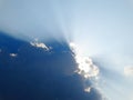 Majestic sun rays penetrate through clouds