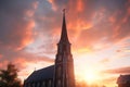 Majestic sunrise illuminating a church steeple