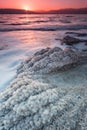 Dead sea sunrise over salt crystals shore - nature of Israel