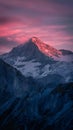 Majestic sunset casts a warm glow over rugged mountain terrain