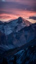 Majestic sunset casts a warm glow over rugged mountain terrain