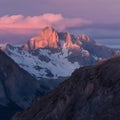 Majestic sunset casts a warm glow over rugged mountain terrain