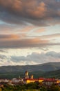 Majestic sunset with colorful clouds above the city of Caransebes