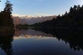 Majestic sunset at Lake Matheson with a reflection of Mount Cook and Mount Tasman in New Zealand. Royalty Free Stock Photo