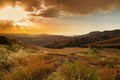 Majestic sunset in mountains landscape. Beautiful sky with clouds and sun rays shine. Mountains sunshine Royalty Free Stock Photo