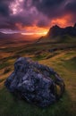 Majestic sunset over a rugged landscape with dramatic clouds