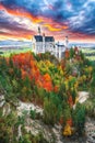 Majestic sunset view of famous Neuschwanstein Castle in autumn