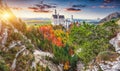 Majestic sunset view of famous Neuschwanstein Castle in autumn