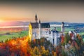 Majestic sunset view of famous Neuschwanstein Castle in autumn