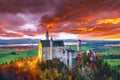 Majestic sunset view of famous Neuschwanstein Castle in autumn