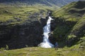 Majestic Swedish Lapland nature. Man looking waterfall in northern Sweden. Arctic mountain landscape