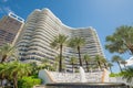 Majestic Towers Condo Bal Harbour Florida with fountain and palm trees in front seen from street