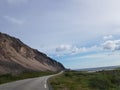 Majestic twisted road with mighty mountain