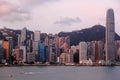 Majestic urban skyline by Victoria Harbour, in Hong Kong, China, with the famous landmark Tower among crowded modern skyscrapers