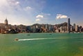 Majestic urban skyline by Victoria Harbour, in Hong Kong, China, with the famous landmark Tower among crowded modern skyscrapers