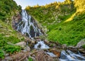 Majestic view of Balea Cascada waterfall in Fagaras mountains, Romania