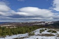 Majestic view of cloudy sky, winter mountain, snowy glade, residential district, conifer and deciduous forest from Plana mountain Royalty Free Stock Photo