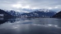 Majestic view of the frozen Zeller lake in Austria with snowy rocky mountains in the background Royalty Free Stock Photo