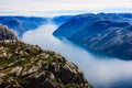 Majestic View from Preikestolen preacher pulpit rock, Lysefjord as background, Rogaland county, Norway, Europe Royalty Free Stock Photo