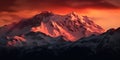 Majestic view of snow capped mountain range at sunrise with fog. AI generated.