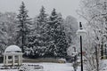 Majestic view of snowy trees and fountain with water from thermal spring in winter park, Bankya Royalty Free Stock Photo