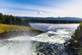 Scenic view of Tannforsen waterfall in Sweden on a sunny day Royalty Free Stock Photo