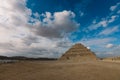 Majestic View to the Step Pyramid of Djoser under blue sky, is an archaeological site in the Saqqara necropolis, northwest of the Royalty Free Stock Photo