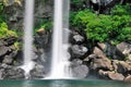 Majestic waterfall falling into creek Royalty Free Stock Photo