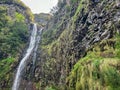 Majestic waterfall lower Cascata Risco along idyllic Levada walk 25 fountains in evergreen subtropical Laurissilva forest Royalty Free Stock Photo