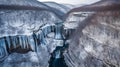 Majestic Waterfalls Cascading Down Snowy Mountain Landscape