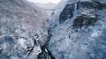 Majestic Waterfalls Cascading Down Snowy Mountain Landscape