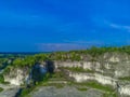 The majestic white limestone cliffs of Bukit Kapur Jaddih in Madura, Indonesia Royalty Free Stock Photo