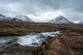 Majestic Winter landscape image of River Etive in foreground with iconic snowcapped Stob Dearg Buachaille Etive Mor mountain in Royalty Free Stock Photo