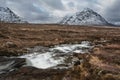Majestic Winter landscape image of River Etive in foreground with iconic snowcapped Stob Dearg Buachaille Etive Mor mountain in Royalty Free Stock Photo