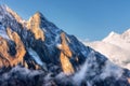 Majestical scene with mountains with sunlit peaks in clouds in Nepal. Landscape