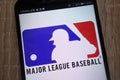 Major League Baseball logo displayed on a modern smartphone