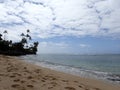 Makalei Beach with waves lapping and helicopter passing by Royalty Free Stock Photo