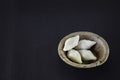 makar sangkranti or poush sangkranti celebration with puli pithe or bengali rice flour dumplings with coconut fillings served on