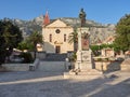 Makarska, Dalmatia, Croatia - July 20, 2021: Cathedral of St. Mark and statue of Andrija Kacic Miosic in the old town.