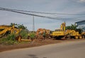 Makassar, Several yellow excavators are on display at the side of the Racing Center road