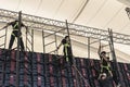 Makati, Metro Manila, Philippines - Production crew assembling a the video panels and scaffolding of a large LED wall