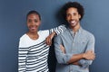 They make a beautiful couple. Portrait of a happy young couple on a gray background. Royalty Free Stock Photo