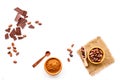 Make chocolate. Cocoa powder in bowl near cocoa beans and pieces of chocolate on white background top view copy space Royalty Free Stock Photo