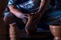 Make a clay mortar Thai. Hands of a potter at work. making ceramic mug