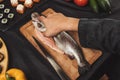 Make cleaning and filleting a fresh cought fish Royalty Free Stock Photo