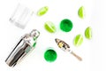 Make cocktail with absinthe. Shaker, shots, lime slices on white background top view Royalty Free Stock Photo